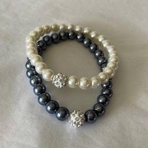 Bracelets white and dark gray pearl like beads with rhinestone details